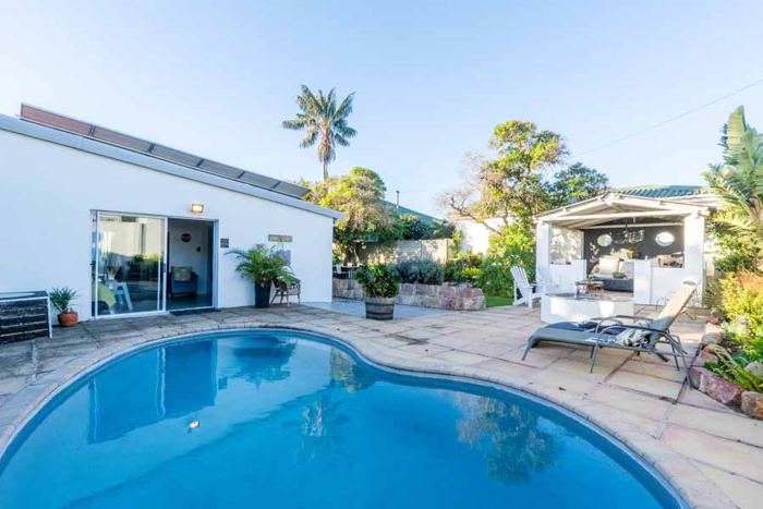 Swimming pool and dining gazebo in the walled garden at Villa Palmera